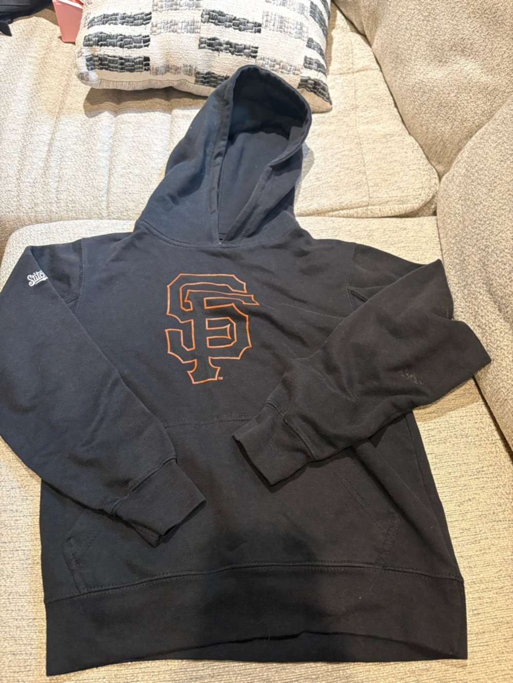 Genuine Merchandise Black Hoodie with Orange SF Logo